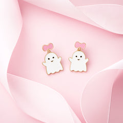 pink white ghost earrings on pink with ribbon