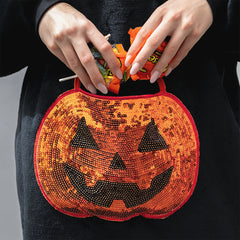 pumpkin blanket hoodie up close of pocket with candy