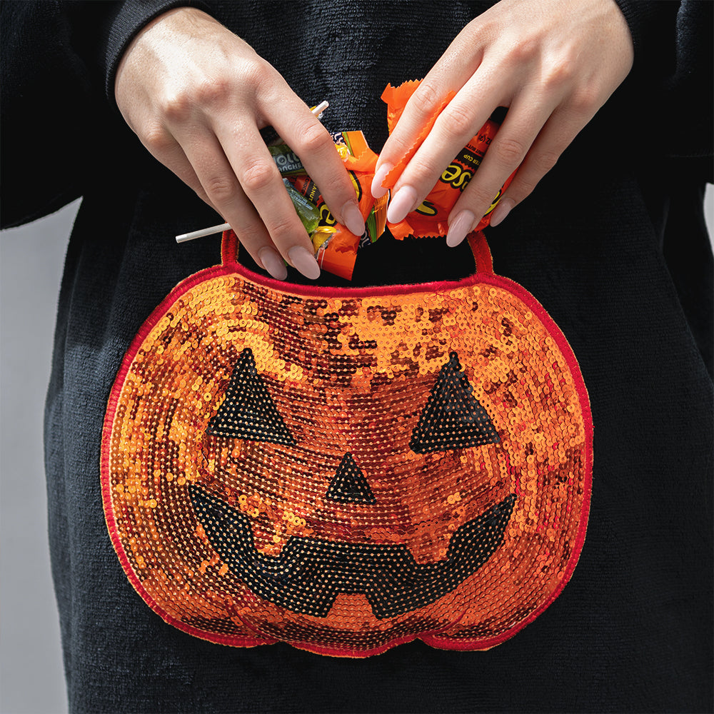 pumpkin blanket hoodie up close of pocket with candy