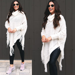 fringe poncho sweater styled for athleisure with sneakers