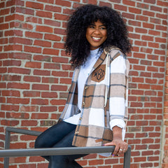 Shacket styled opened on girl by a brick wall