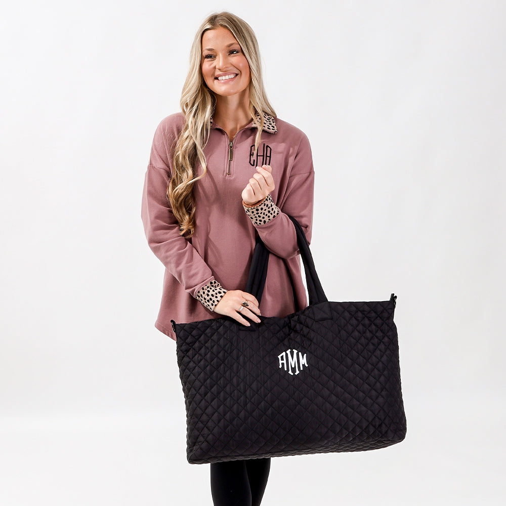 black diamond quilted weekender on arm