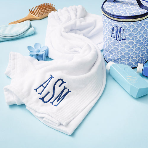 white monogrammed towel wrap with blue shells ditty bag