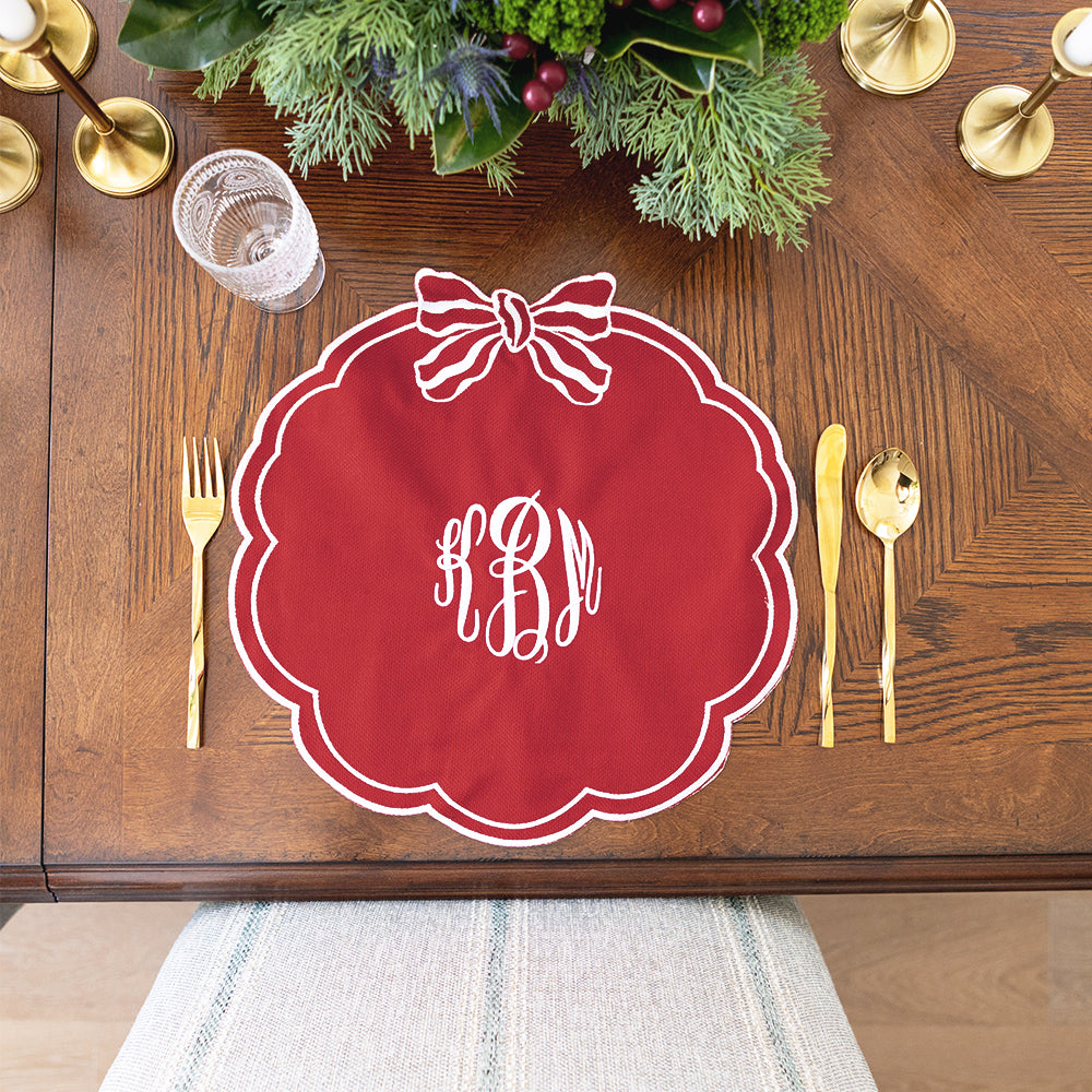red bow scallop placemat on table