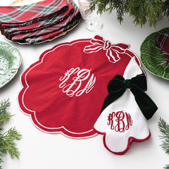 red bow scallop placemat with napkin and bow napkin holders