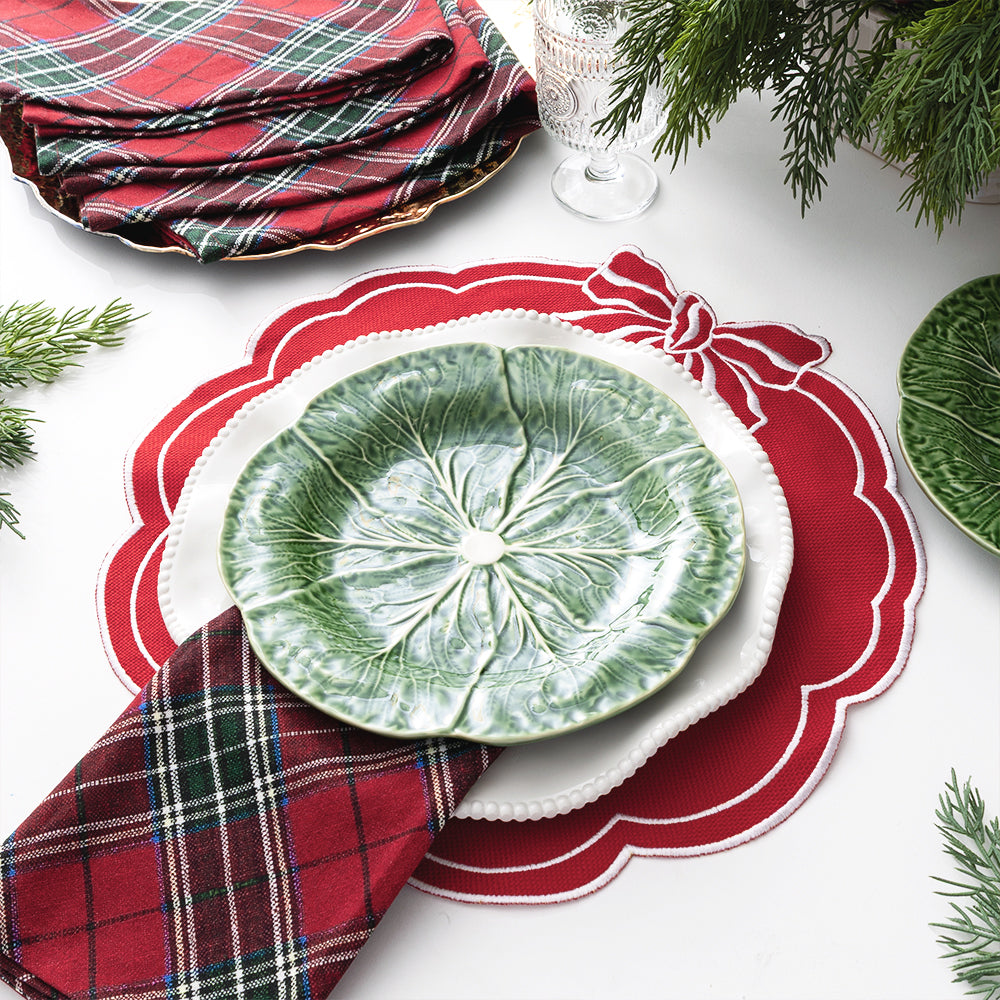 red bow scallop placemat with plates on top
