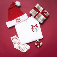 red bow socks ootd flatlay with bow christmas sweatshirt