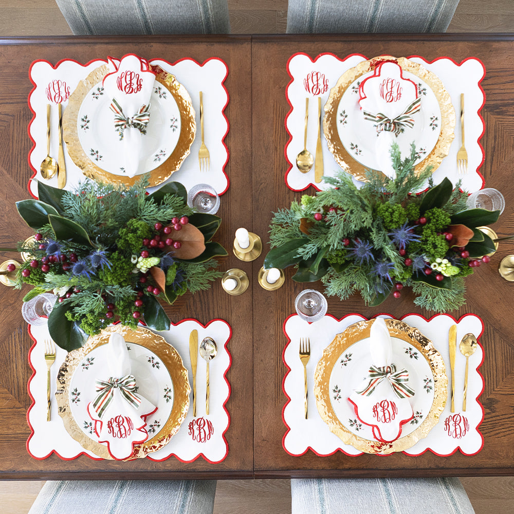 red scalloped napkins and placemat 4 christmas place settings from above