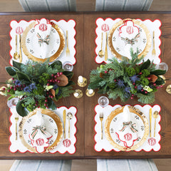 red scalloped napkins and placemat 4 christmas place settings from above