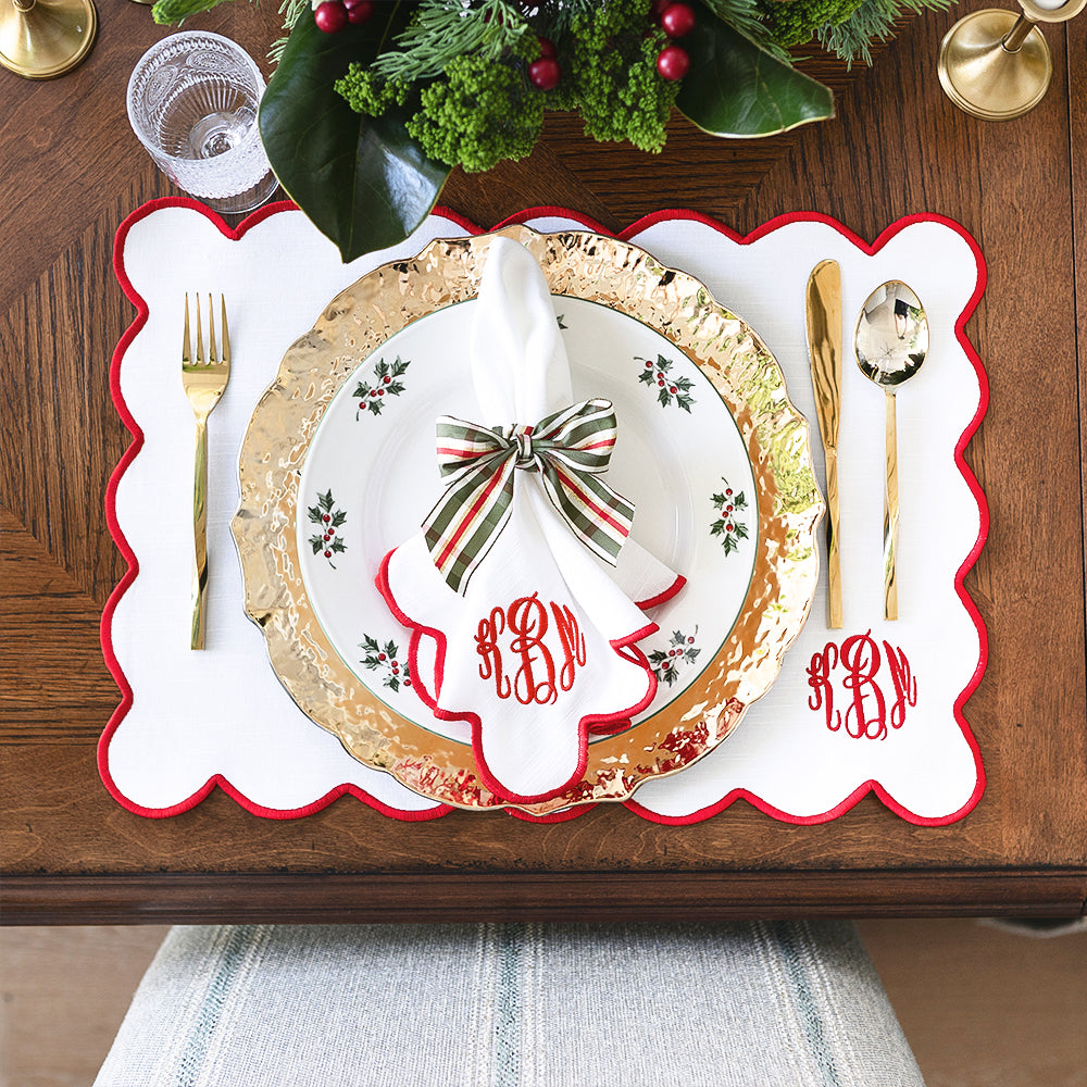red scalloped napkins and placemat christmas place setting from above