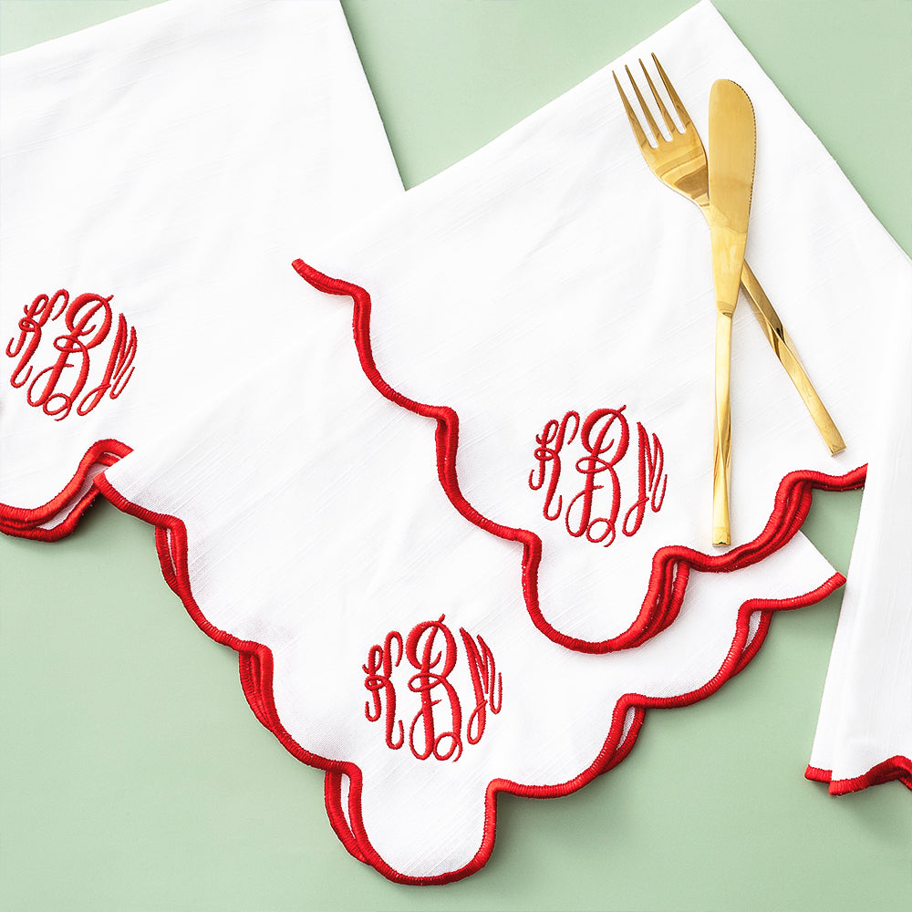 red scalloped napkins on green