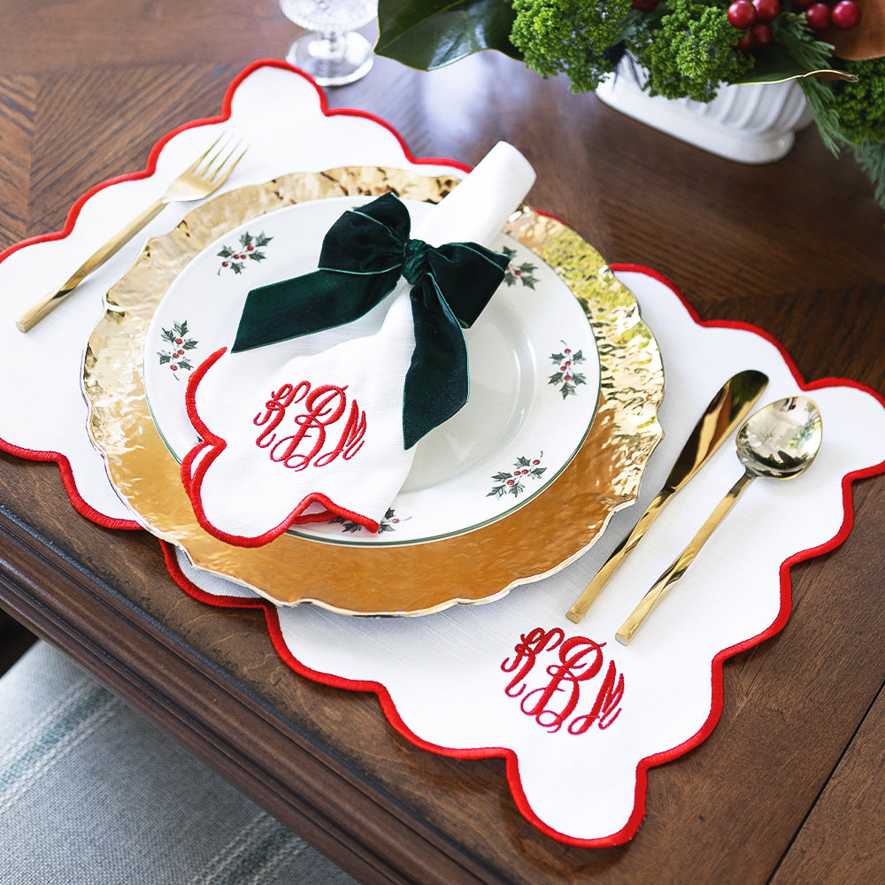 red scalloped napkins with placemat christmas place setting