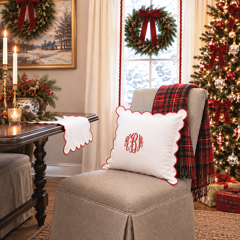 red scalloped pillow sham and table runner christmas scene
