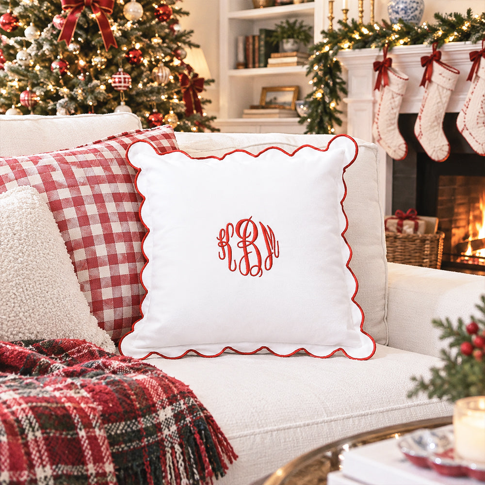 red scalloped pillow sham on couch christmas scene