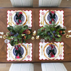 red scalloped placemat 4 christmas settings from above