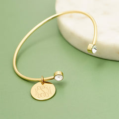 rhinestone cuff bangle on green background