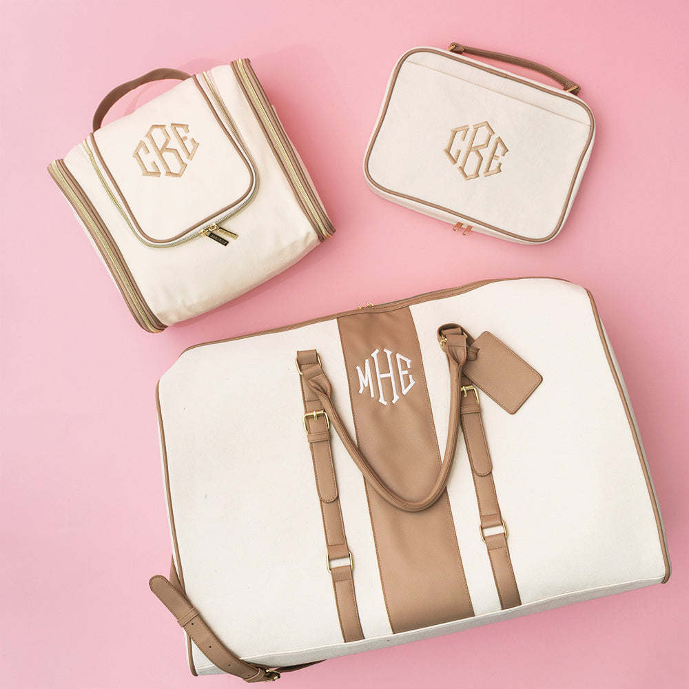 ivory monogrammed hanging toiletry bag and cosmetic and weekender bags