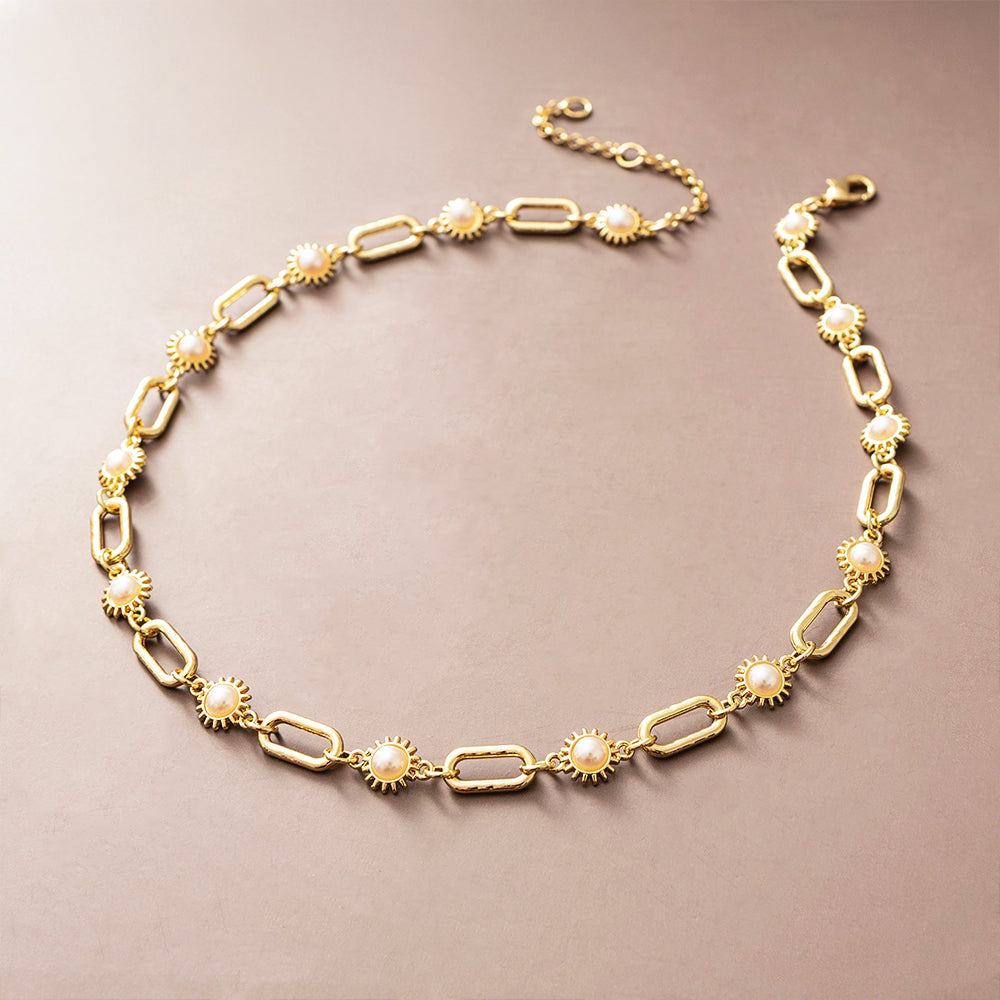 gold pearl starburst necklace studio shot