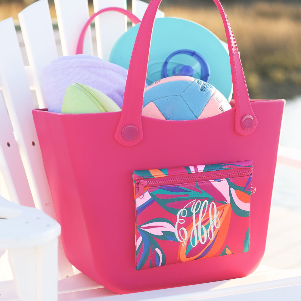 personalized waterproof beach bag in pink island sunset on beach chair