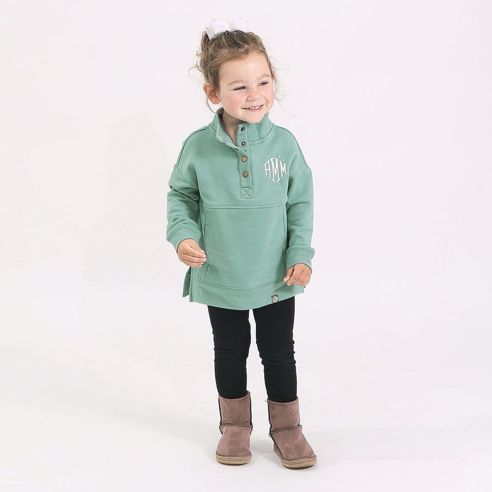 toddler in sage sweatshirt and leggings