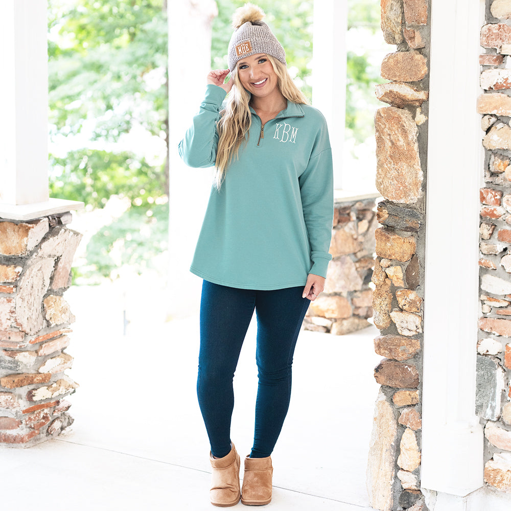 sage quarter zip sweatshirt on katie