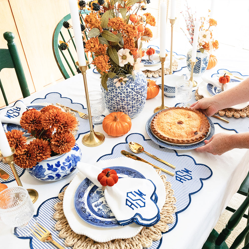 scalloped placemats and napkins in navy tablescape