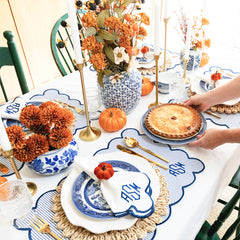 scalloped placemats and napkins in navy tablescape