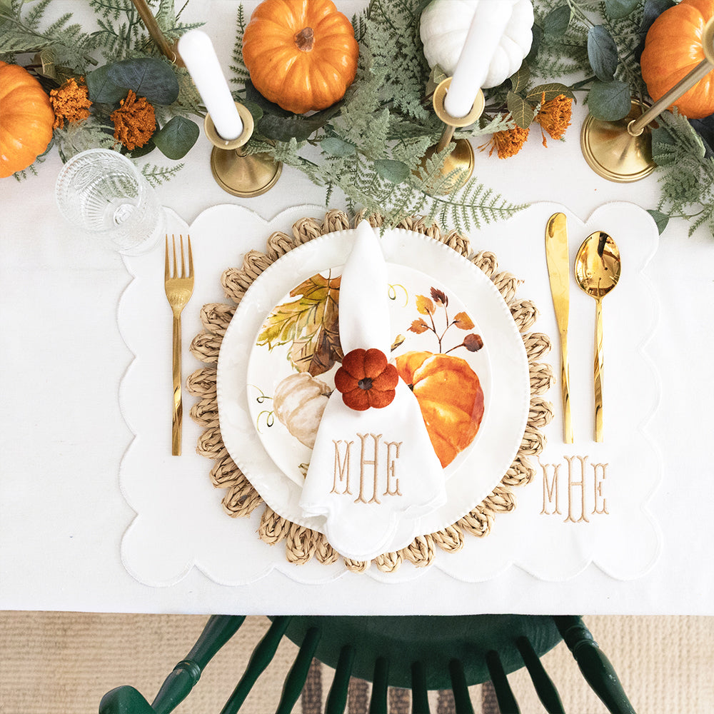 scalloped placemats and napkins in white with fall decor