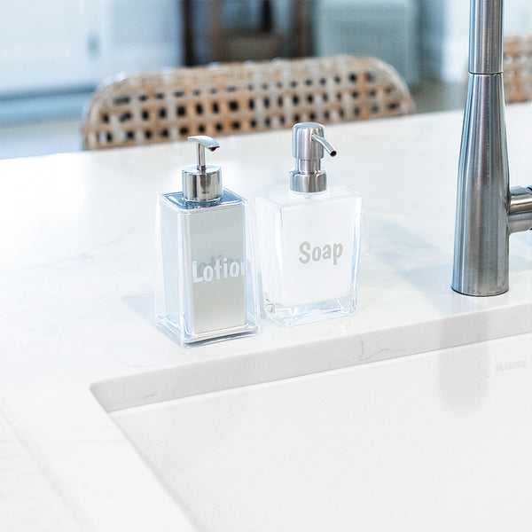 soap dispenser and lotion bottle on kitchen counter