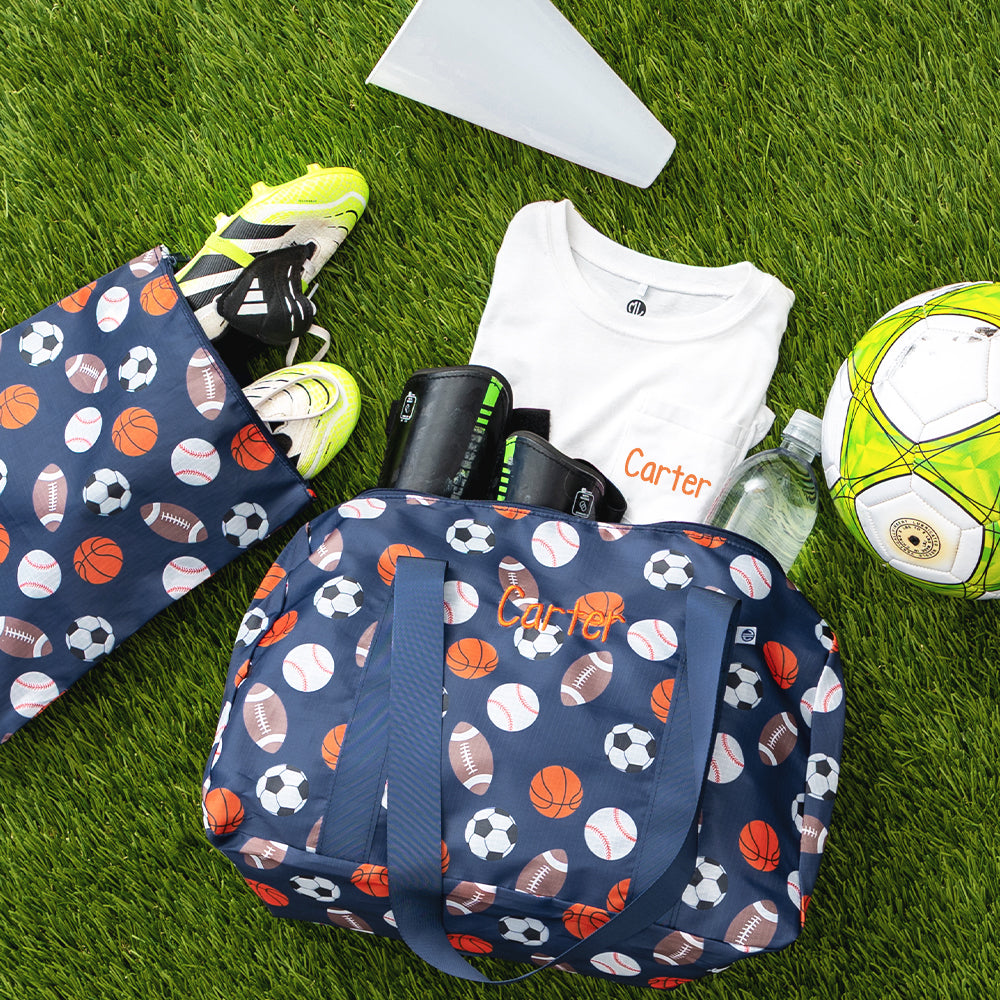 sports balls kids activity bag in grass