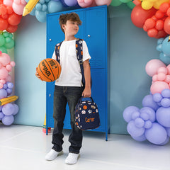 sports balls lunchbox and backpack carried by boy
