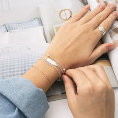 silver personalized multi strand bracelet on wrist