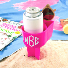monogrammed sand buddy in sand and towel