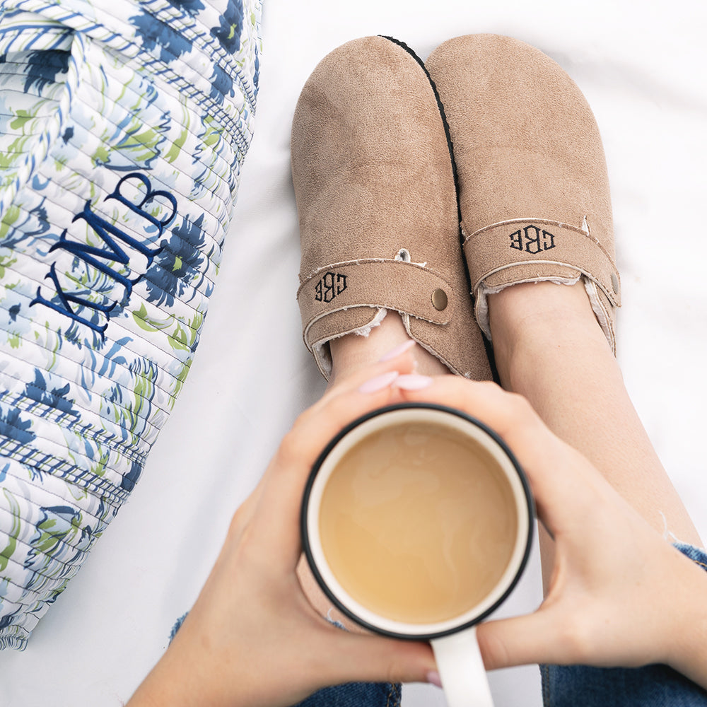 tan monogrammed clogs with coffee