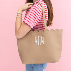 tan scallop tote bag on girls shoulder