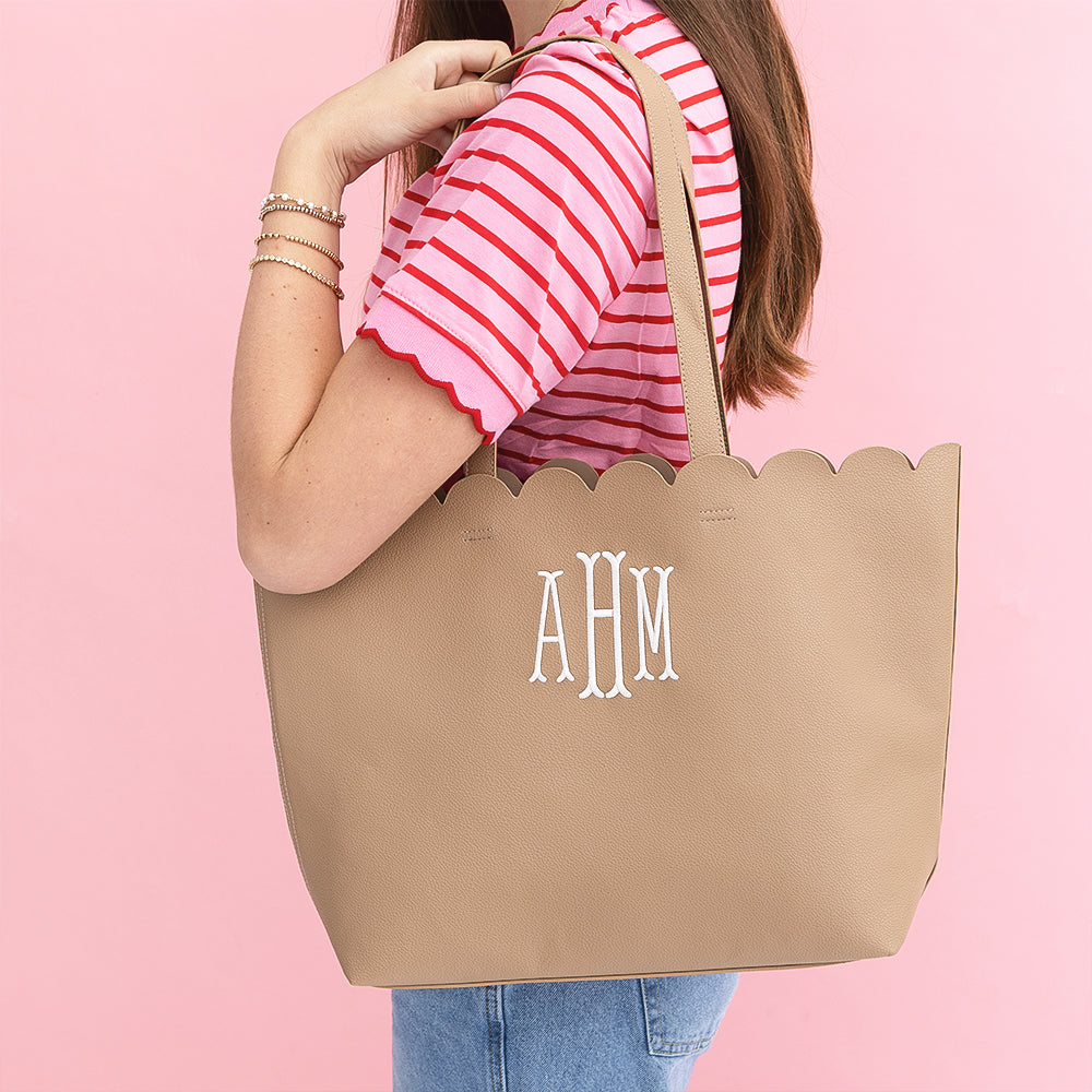 tan scallop tote bag on girls shoulder