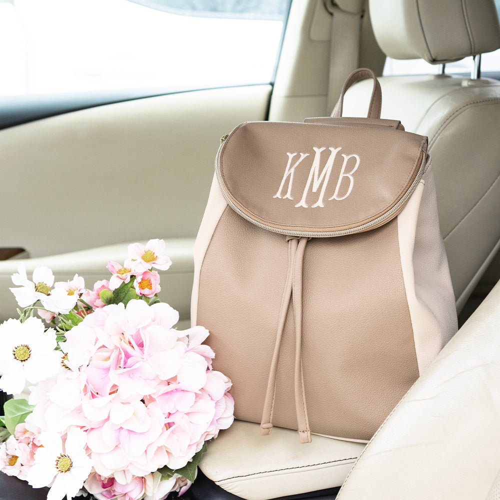 taupe backpack purse in car