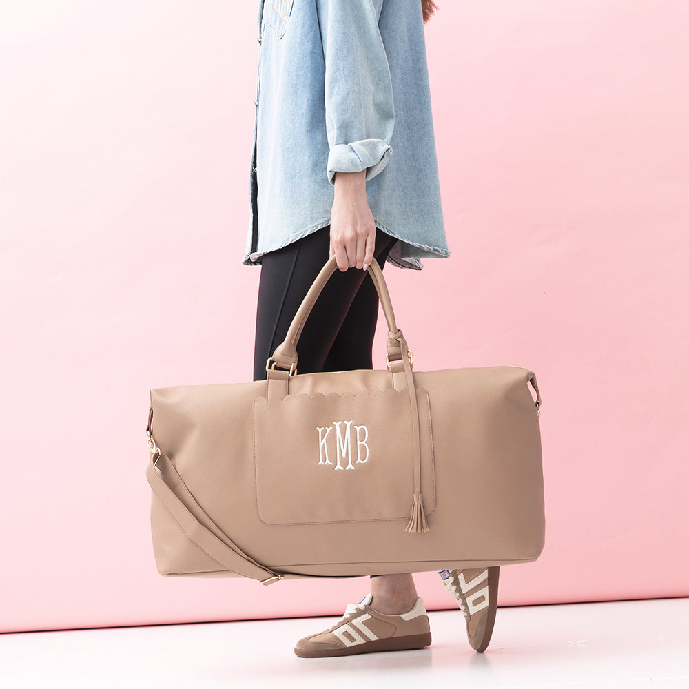 taupe classic scallop weekender in hand