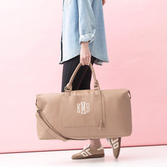 taupe classic scallop weekender in hand