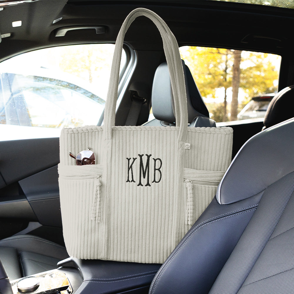 taupe grey pocket tote bag in car