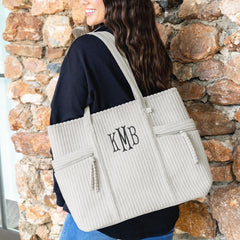 taupe grey pocket tote bag on shoulder