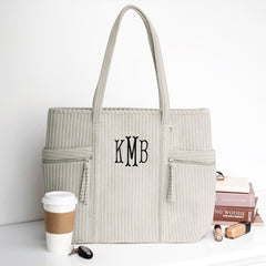 taupe grey pocket tote bag studio shot