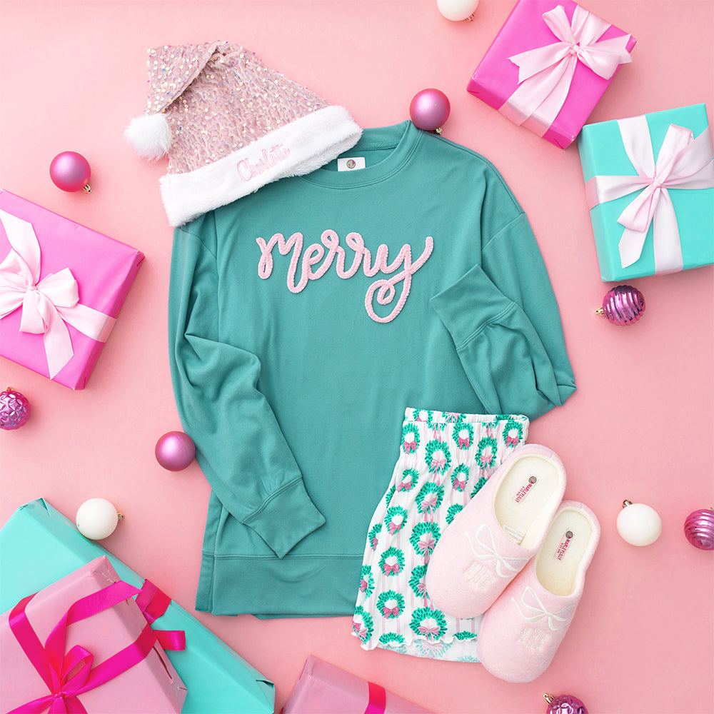 teal chenille merry sweatshirt flatlay