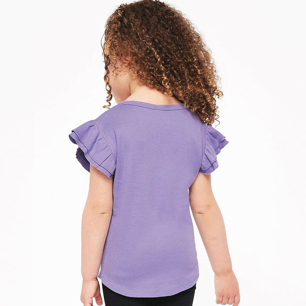 Child wearing a purple ruffled shirt on a white background