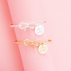 gold and silver bangles on pink
