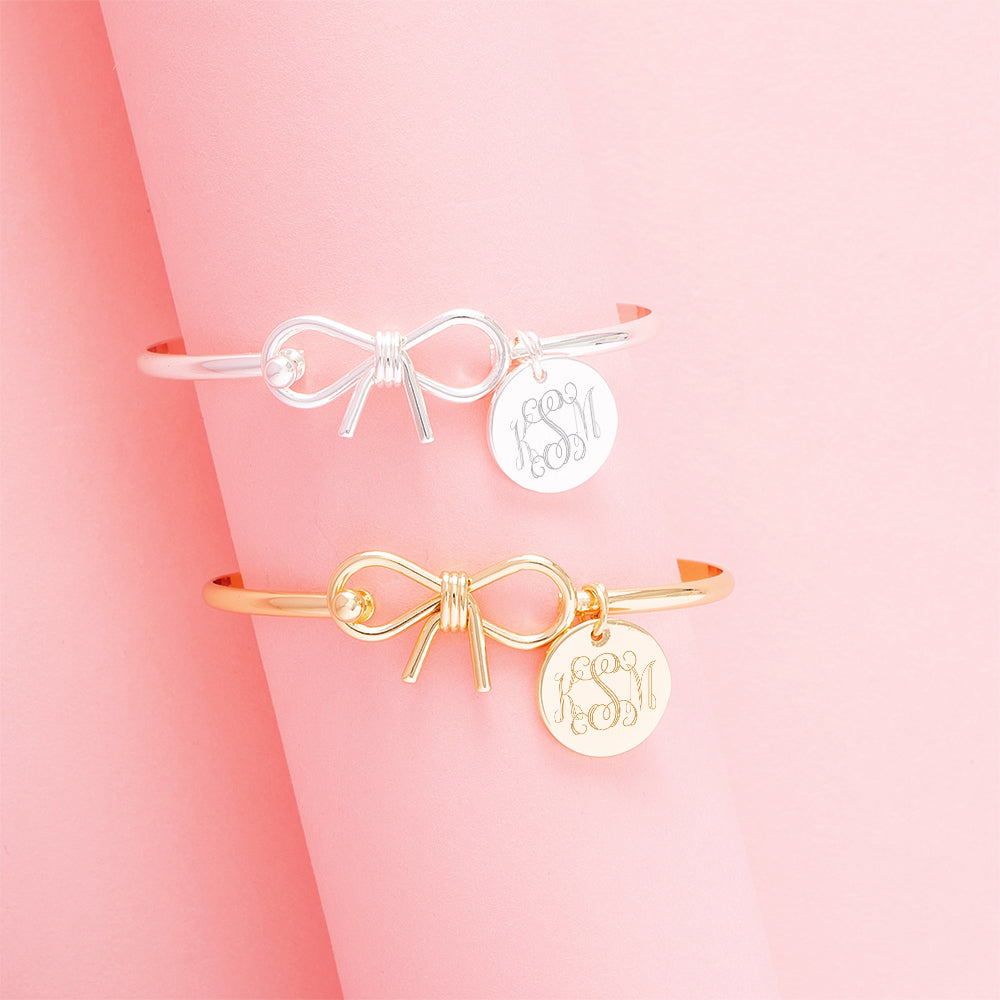 gold and silver bangles on pink