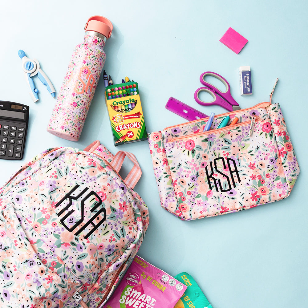 coral floral essentials pouch with backpack and water bottle