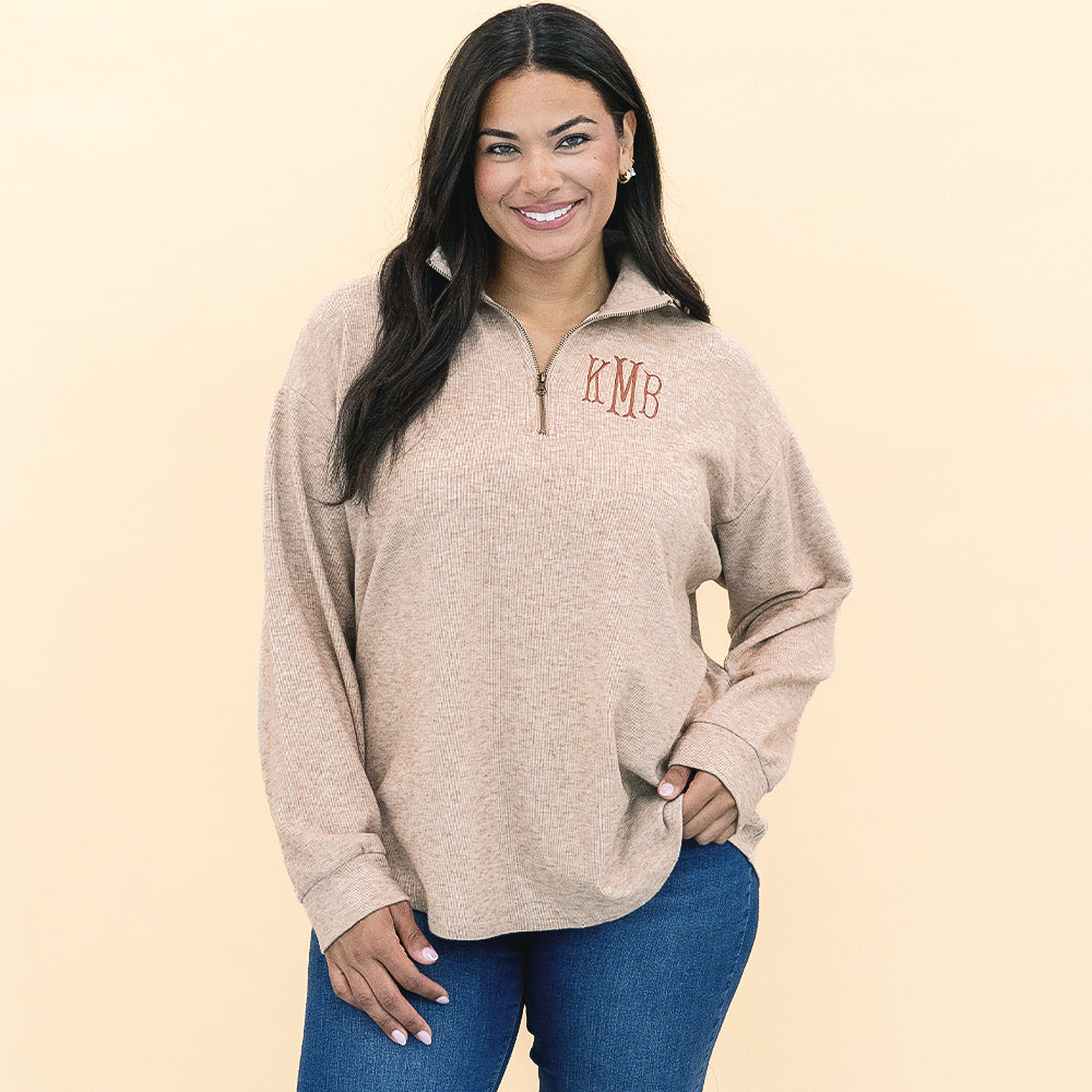 girl wearing personalized heathered fleece pullover in tan