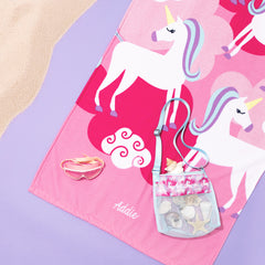 girls pink beach towel with unicorn design and embroidered name