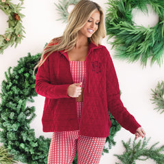 up close of girl wearing monogrammed quilted red hoodie jacket with plaid athletic set